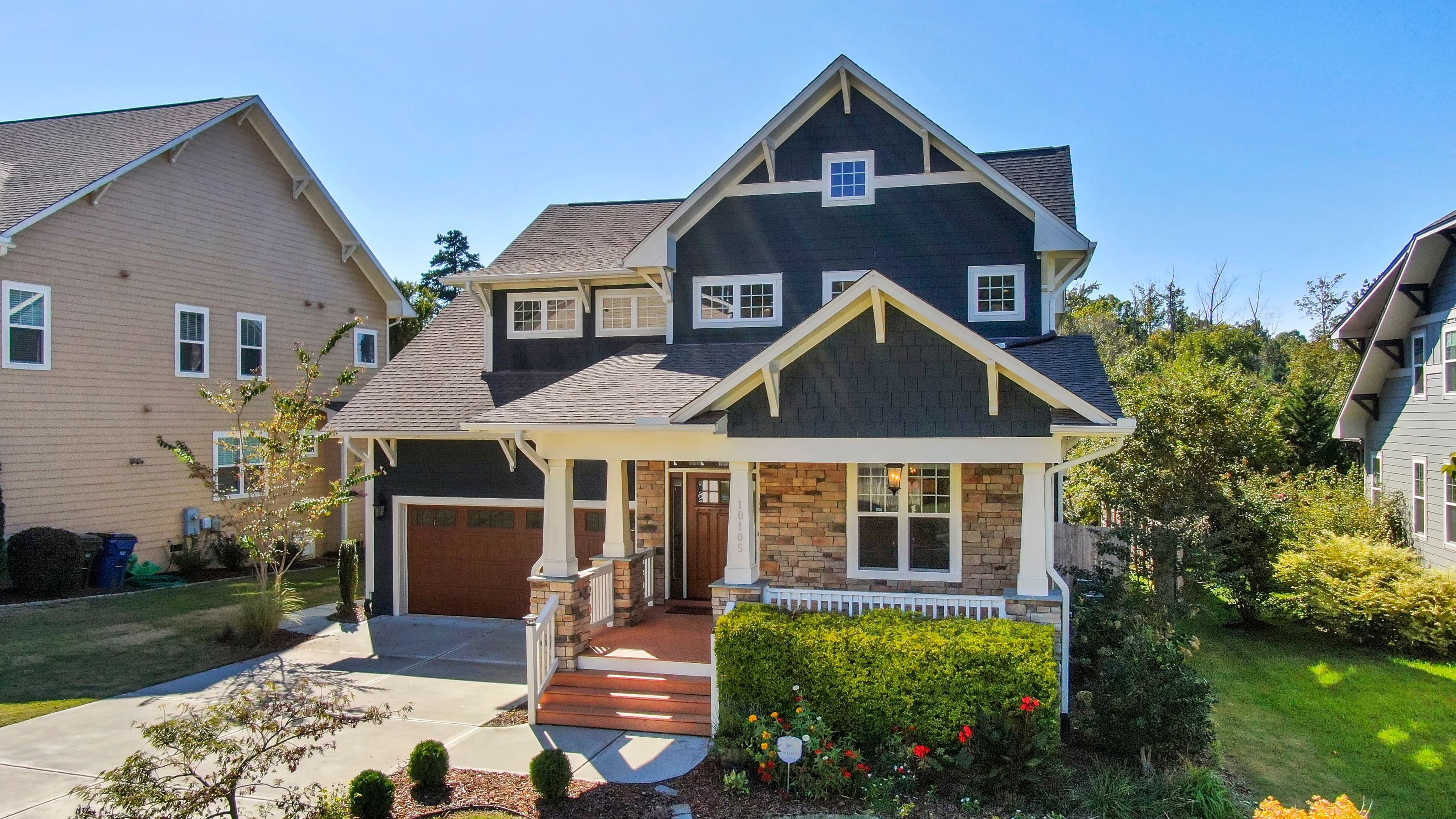 A modern home on a wide block with an established front garden.